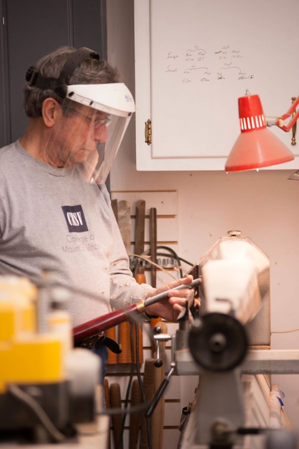 Man using a lathe for wood turning