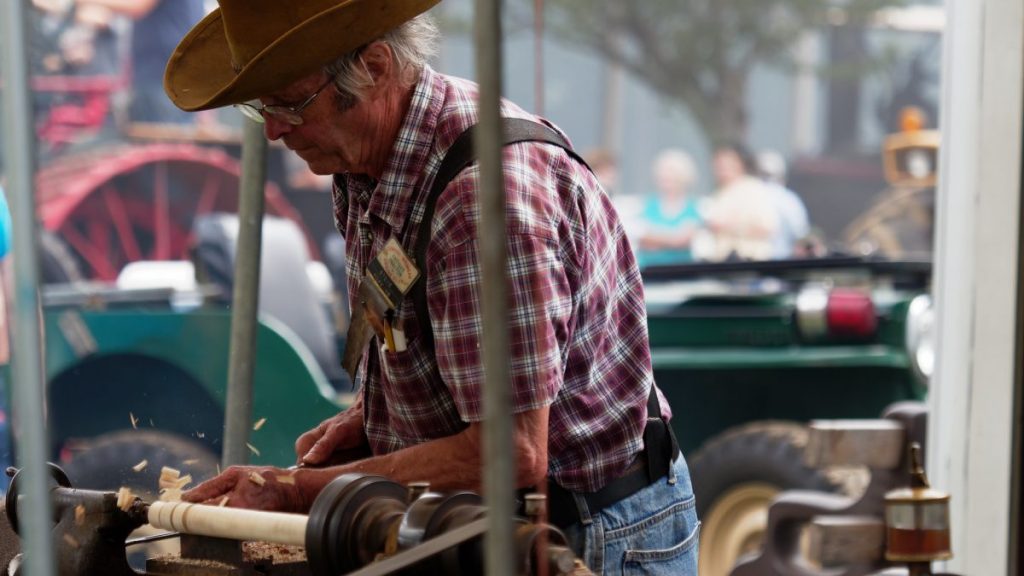 Man using a lathe for woodturning