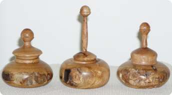 Three ring holder boxes each turned from one piece of dry mesquite making the finial and top in one piece.