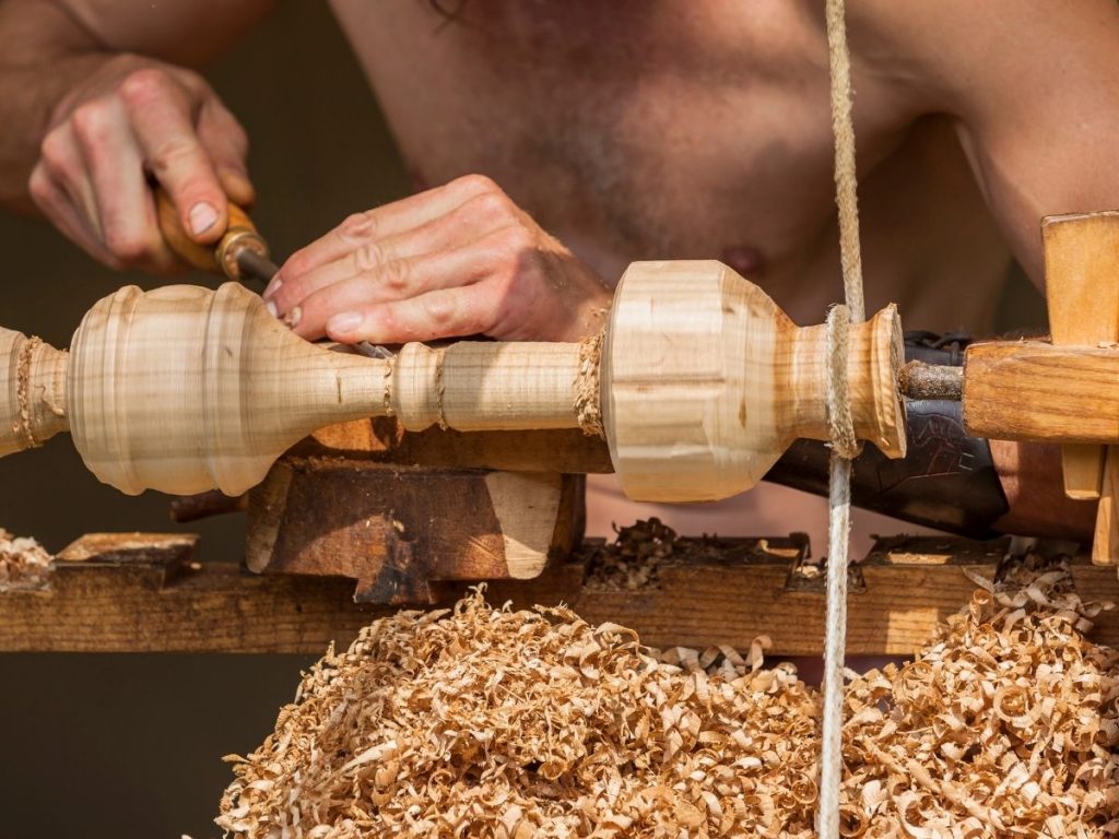 Man turning a spindle